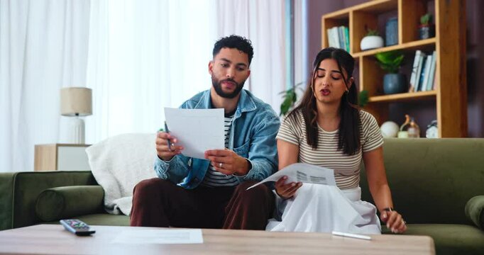 Living room, couple and document for financial discussion, cost comparison and planning budget together with taxes. Man, woman and paperwork in home for mortgage invoice, bills or debt management