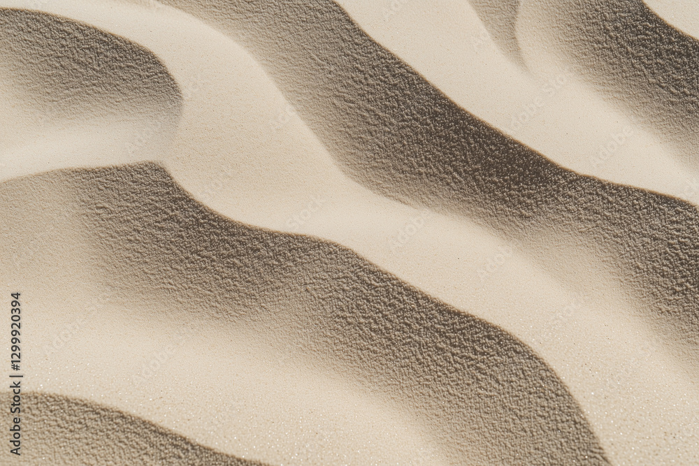 Poster Wavy sand dunes create mesmerizing pattern with light and shadow play