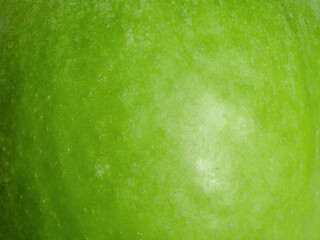 Texture of green apple macro photo as background.