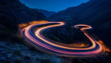 A winding road with long exposure lights.