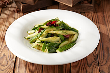 Pickled cucumber strips in mustard oil and salt water