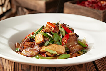 Stir-fried bacon with garlic sprouts, rice pepper and dried tofu