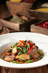 Stir-fried bacon with garlic sprouts, rice pepper and dried tofu