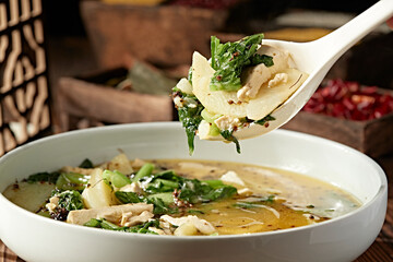 Potato, tofu and cabbage stew with sesame flowers