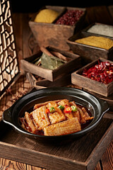 Spicy stewed hairtail with red oil in casserole