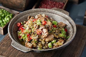 Double peppers, preserved vegetables and pork intestines in stone pot