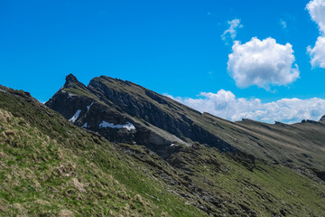 Jagged peaks ascend near mountain peak Reitereck, Austria. Steep, grassy slopes of the Ankogel Group in the Lieser-Maltatal region, Carinthia, creating a stunning alpine vista in remote Austrian Alps
