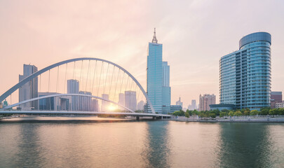 Obraz premium The urban architectural skyline, modern bridges, and Haihe River scenery of Tianjin, China on August 11, 2024
