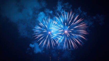 Blue fireworks light up the night sky with vibrant bursts of color.