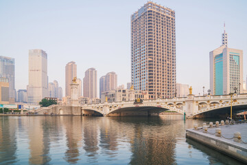 Obraz premium The urban architectural skyline, modern bridges, and Haihe River scenery of Tianjin, China on August 11, 2024 