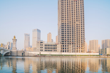 Obraz premium The urban architectural skyline, modern bridges, and Haihe River scenery of Tianjin, China on August 11, 2024 