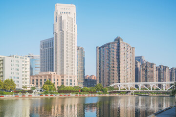 Obraz premium The urban architectural skyline, modern bridges, and Haihe River scenery of Tianjin, China on August 11, 2024