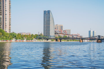 Fototapeta premium The urban architectural skyline, modern bridges, and Haihe River scenery of Tianjin, China on August 11, 2024