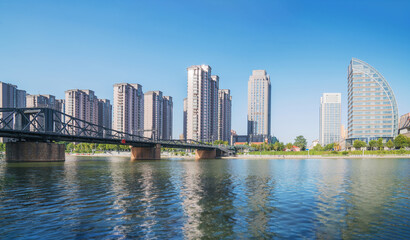 Fototapeta premium The urban architectural skyline, modern bridges, and Haihe River scenery of Tianjin, China on August 11, 2024