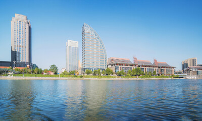 Obraz premium The urban architectural skyline, modern bridges, and Haihe River scenery of Tianjin, China on August 11, 2024