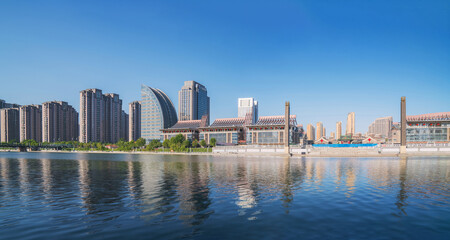 Naklejka premium The urban architectural skyline, modern bridges, and Haihe River scenery of Tianjin, China on August 11, 2024