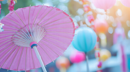 Delicate Pink Umbrella Among Colorful Lanterns and Soft Lighting