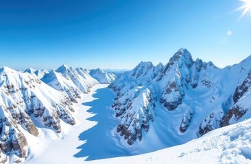 Majestic snow-covered mountain range under clear blue sky