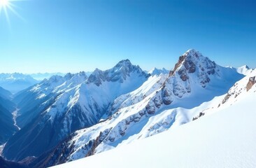 Fototapeta premium Snowy mountain range under clear blue sky on a sunny day