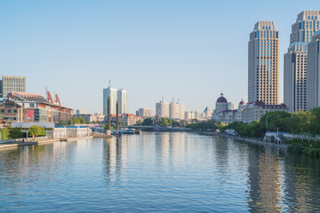 Obraz premium The urban architectural skyline, modern bridges, and Haihe River scenery of Tianjin, China on August 11, 2024