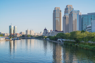 Obraz premium The urban architectural skyline, modern bridges, and Haihe River scenery of Tianjin, China on August 11, 2024