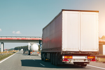 Truck and car on rural highway road.