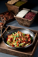 Hunan-style stir-fried pork intestines with rice pepper, garlic sprouts and celery