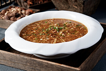 Oat noodle with pickled cabbage, potato and minced meat stew