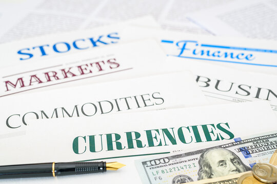 The various aspects of the financial markets, stocks, currencies, commodities, and business. Financial documents, and US dollar bills, symbolizing global trade, market analysis and economic activity.