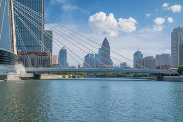 The urban architectural skyline, modern bridges, and Haihe River scenery of Tianjin, China on August 11, 2024