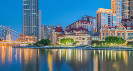 Fototapeta premium The urban architectural skyline, modern bridges, and Haihe River night scenery of Tianjin, China on August 11, 2024 ﻿