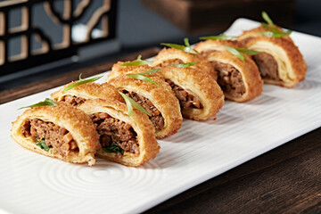 Fried duck meat, egg and omelette rolls