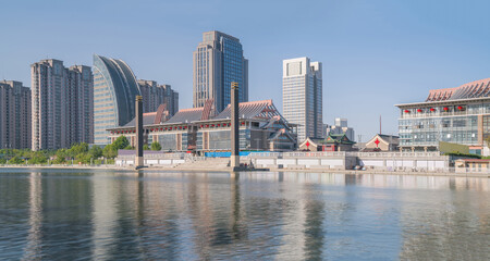 Naklejka premium The urban architectural skyline, modern bridges, and Haihe River scenery of Tianjin, China on August 11, 2024
