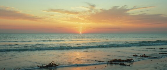 Vertical shot of a warm sunset over the ocean.