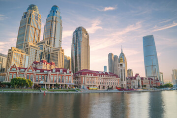 Obraz premium The urban architectural skyline, modern bridges, and Haihe River scenery of Tianjin, China on August 11, 2024