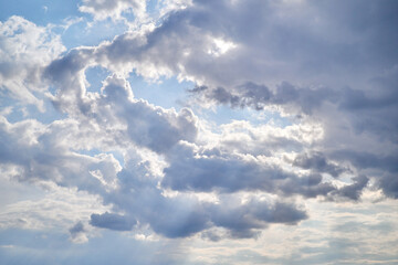 Cumulus clouds. White clouds on the blue sky close-up.