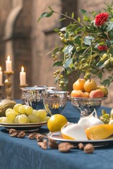 Elegant Table Setting with Fruit and Candles for Special Occasion