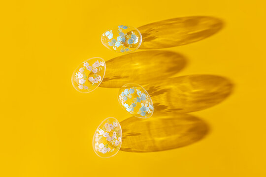 Bright Easter Eggs in yellow background