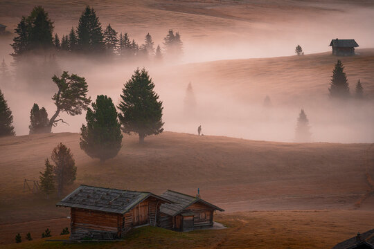 Traditional huts in autunm mist, Dolomites