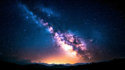 Naklejka premium Vibrant Milky Way Galaxy Stretching Across Dark Blue Sky Above Horizon