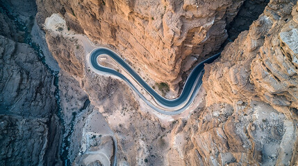 Naklejka premium Aerial View Winding Mountain Road Desert Canyon Cliff Landscape Travel