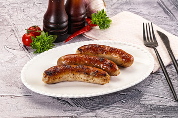 Delicous natural roasted sausages in the plate