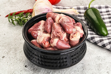 Fresh raw chicken hearts in the bowl