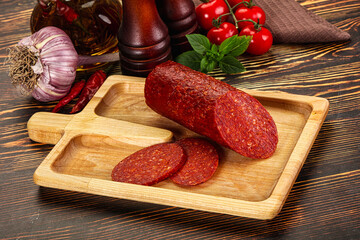 Spicy pepperoni sausages with sliced piece