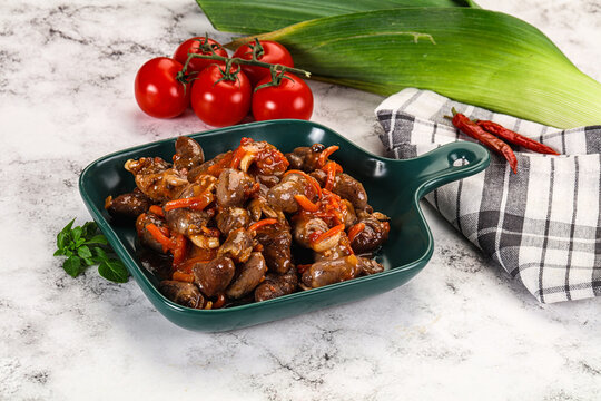 Baked chicken hearts with vegetables