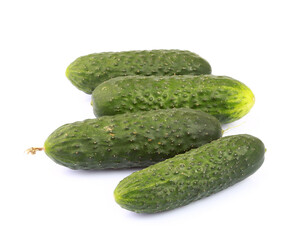 Heap of cucumbers isolated on white background with clipping path