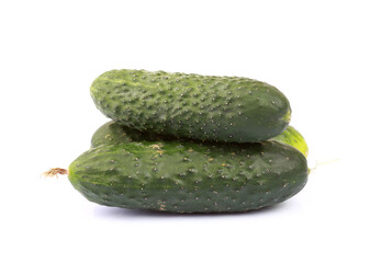 Heap of cucumbers isolated on white background with clipping path