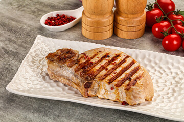 Grilled pork loin steak with bone