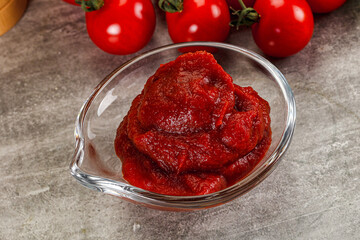 Red tomato paste in the bowl