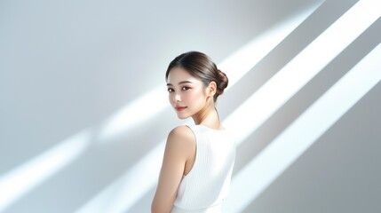 Elegant Asian woman with perfect skin in natural sunlight portrait